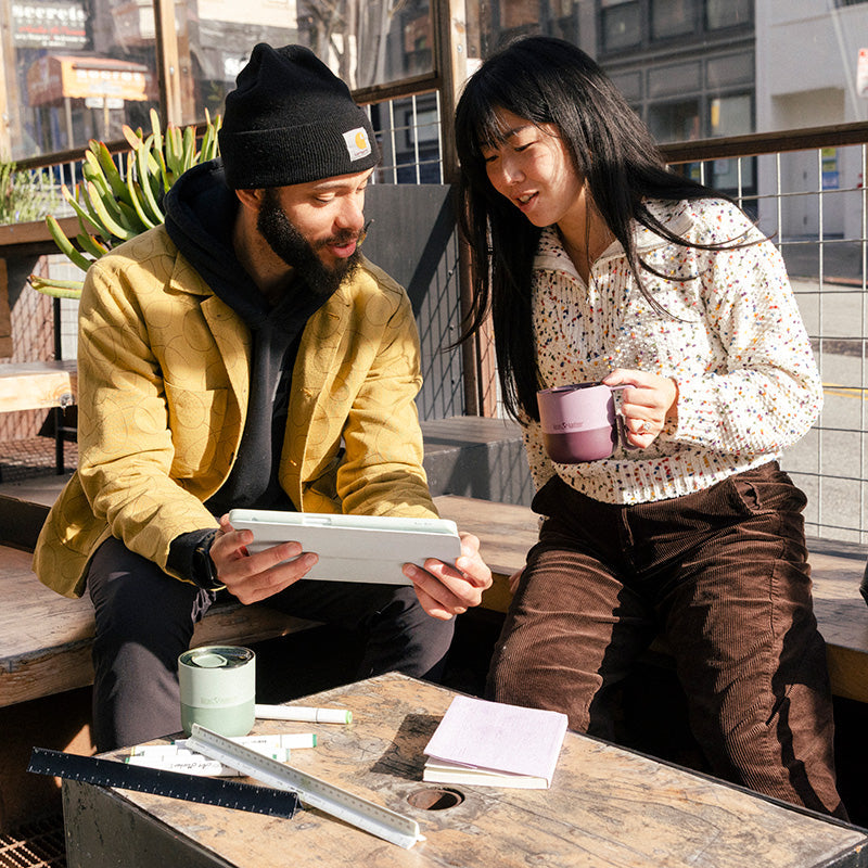 12oz-rise-mug-b7 12oz_rise_coffee_mug_dusty_orchid_couple_city_patio_square.jpg