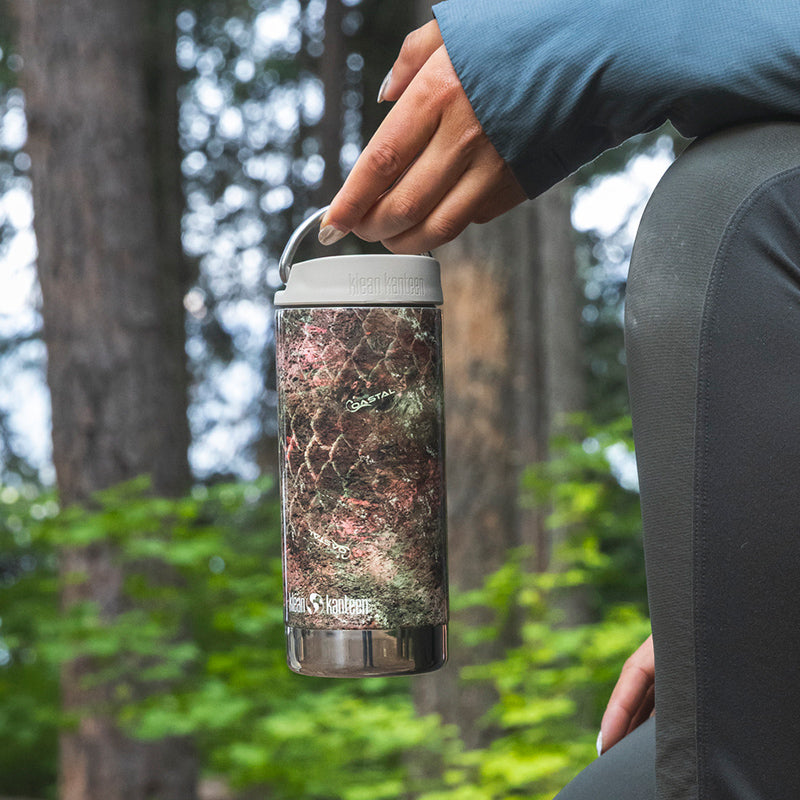 12oz-tkwide-with-twist-cap-mossy-oak-p6 12oz_tumbler_mossyoak_rainbowtrout_hand_closeup_square.jpg