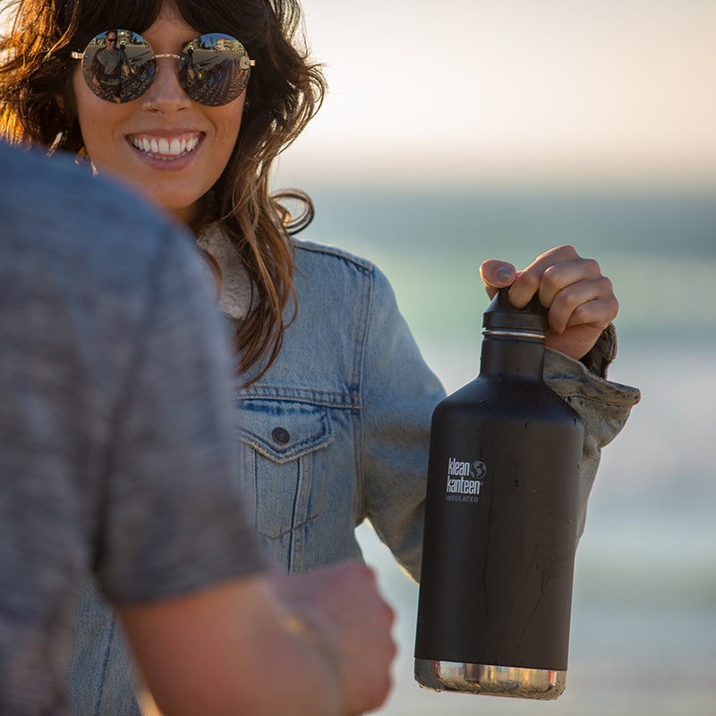 64oz-classic-with-loop-cap-y1 64oz_insulated_classic_black_beach_girl_hand_square.jpg
